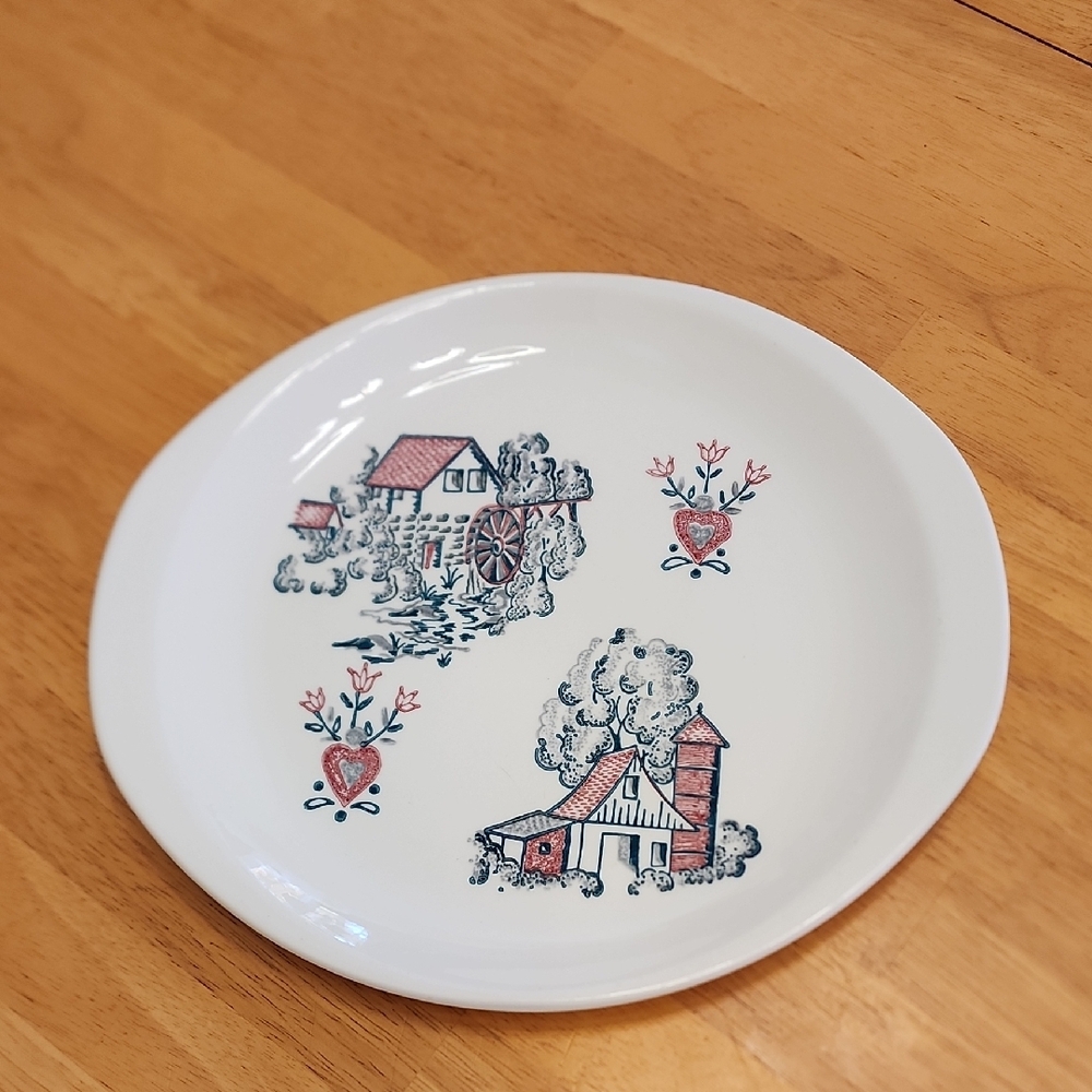 Vintage White Ceramic Plate with Rustic Design